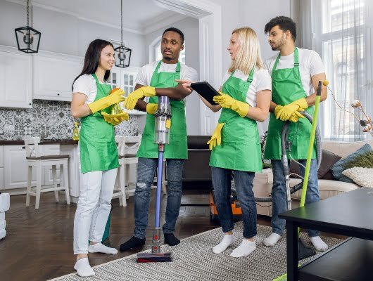 multiracial-team-of-cleaning-service-using-digital-2024