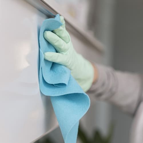 side-view-hand-with-glove-cleaning-surface-with-cloth