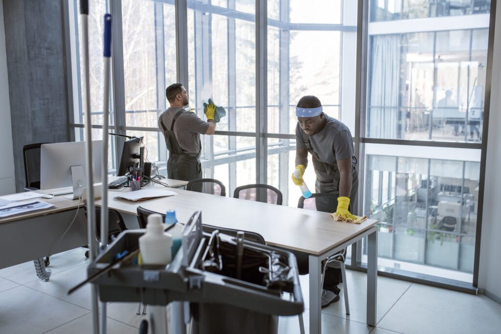 full-shot-men-cleaning-office portrait-man-light-wooden-background-wearing-his-gloves.